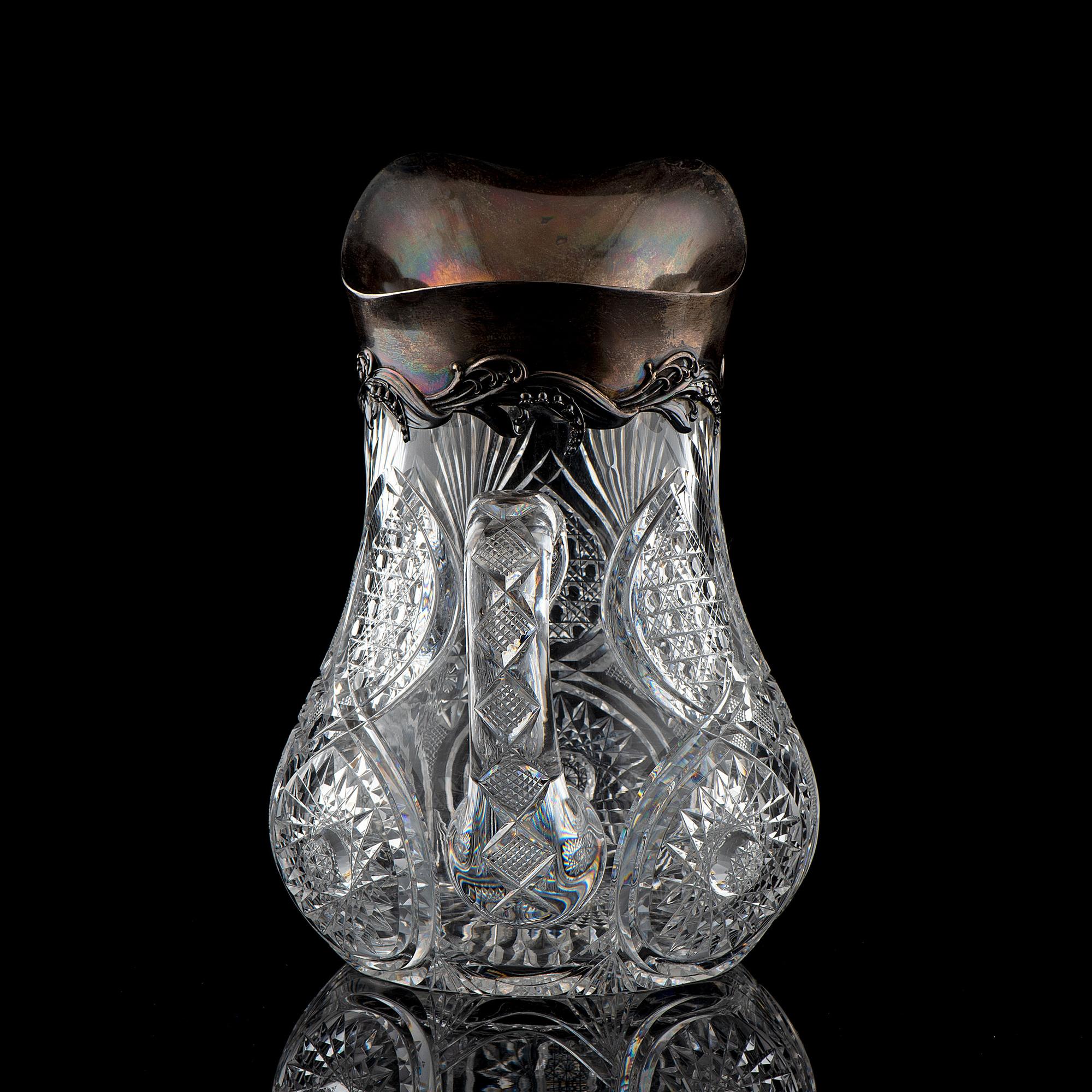 A Brilliant-Period Cut Glass Water Pitcher with Lilies of the Valley and a Silver Mount
