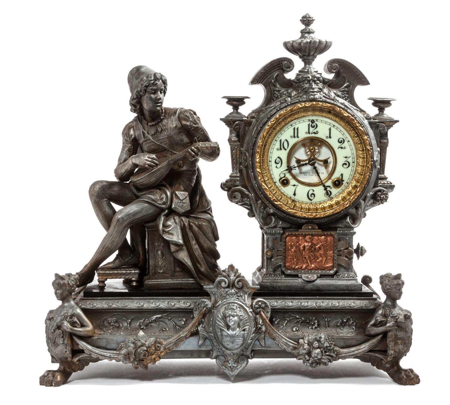 A Cast Metal Figural Mantle Clock Height 19 1/2 x width 19 1/4 x depth 7 1/2 inches. — ANSONIA