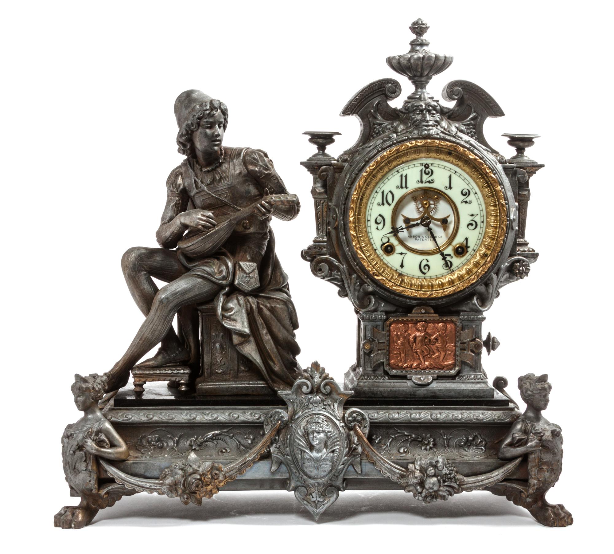 A Cast Metal Figural Mantle Clock Height 19 1/2 x width 19 1/4 x depth 7 1/2 inches. — ANSONIA