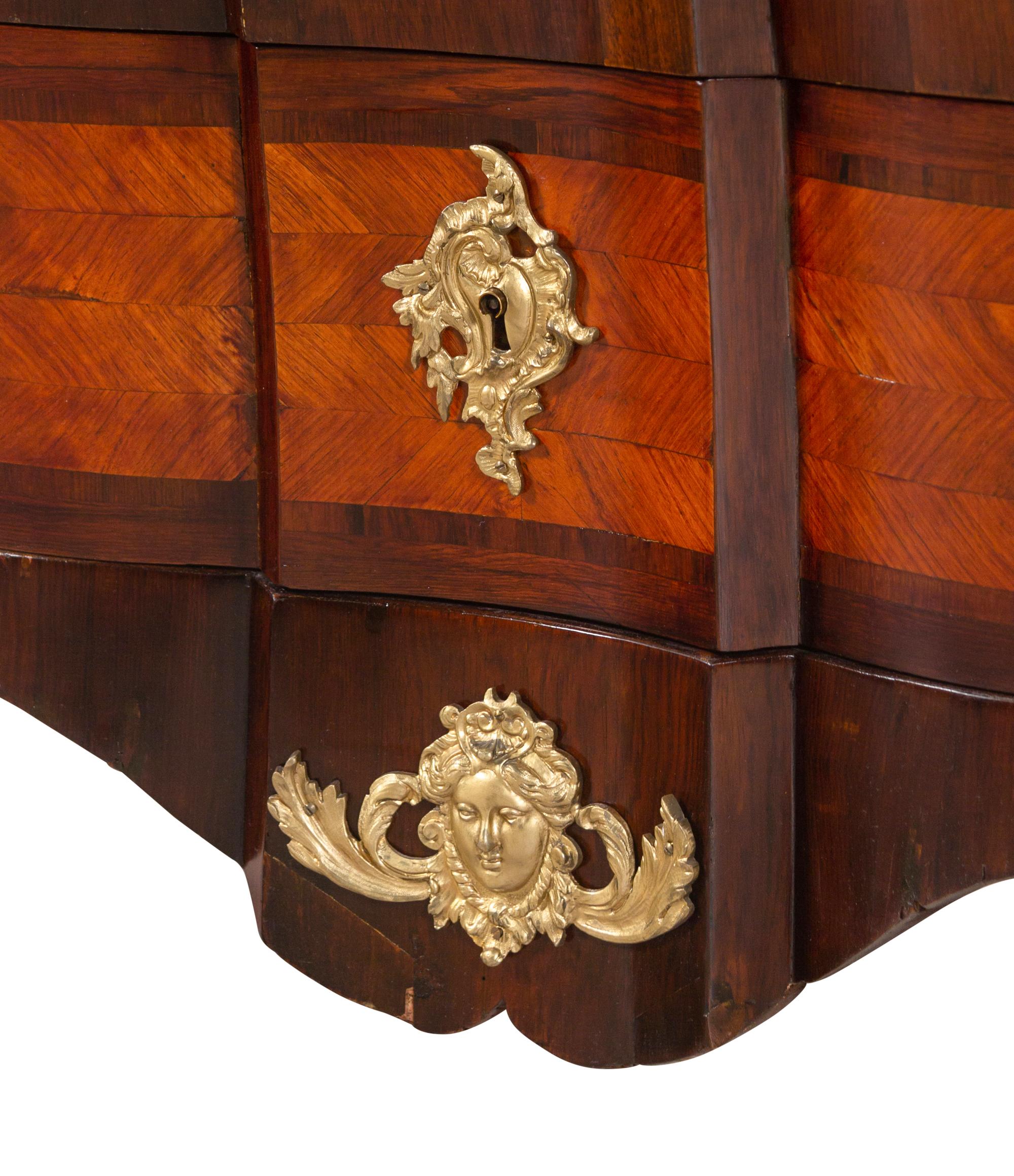 A Régence Style Gilt Bronze Mounted Parquetry Marble-Top Bombe Commode