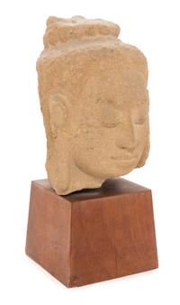 A Thai Stone Head of a Deity Height 6 1/4 inches.