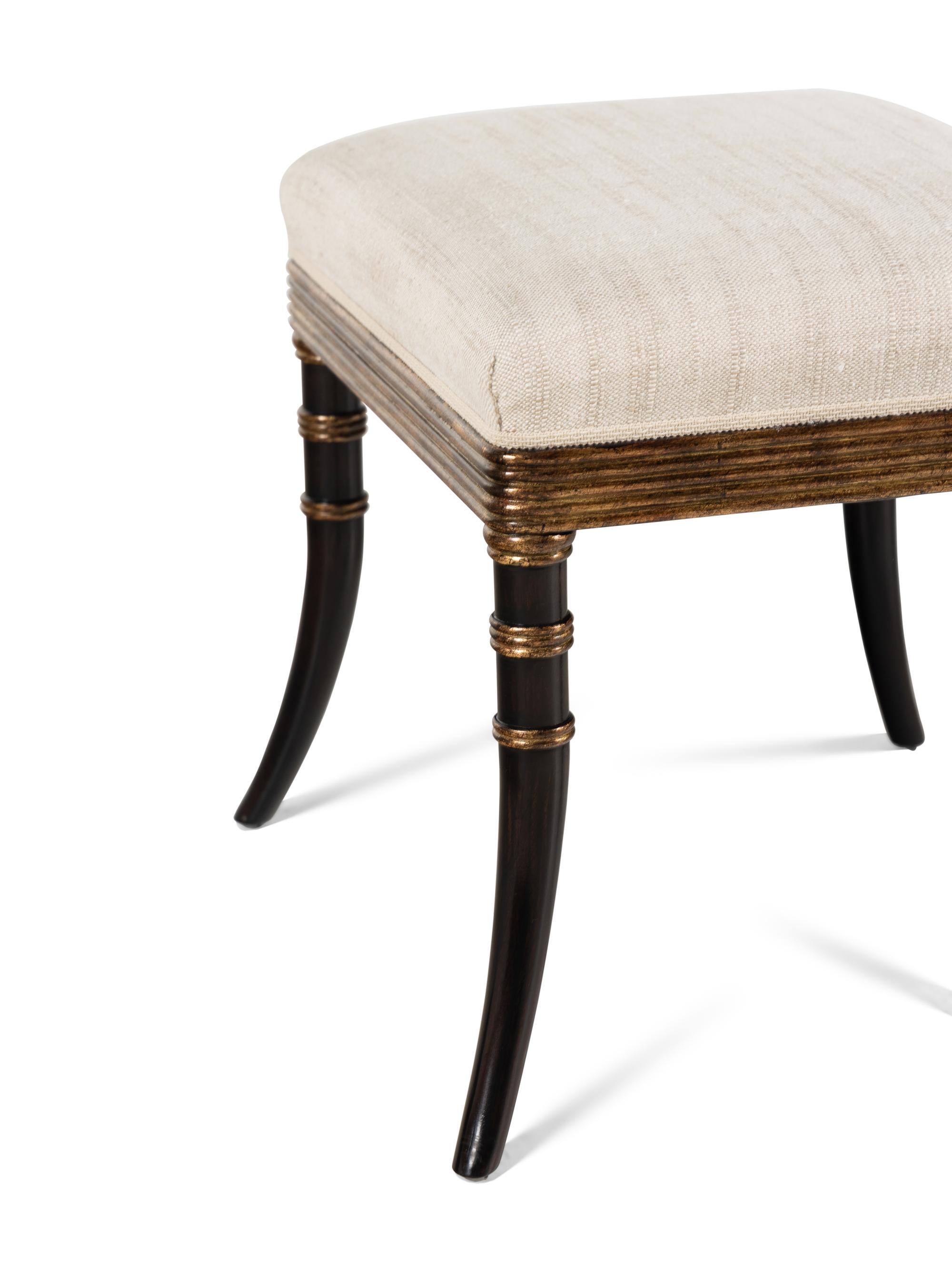A Pair of Rose Tarlow Ebonized and Parcel-Gilt Stools