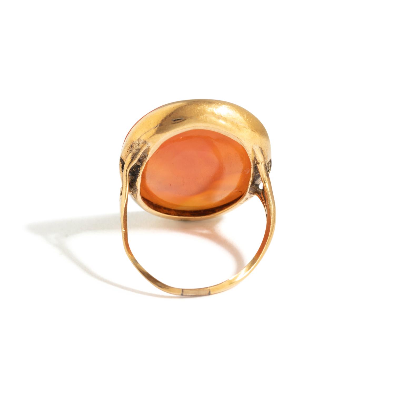 A Neoclassical Gold and Carnelian Finger Ring with a Muse Playing a Harp