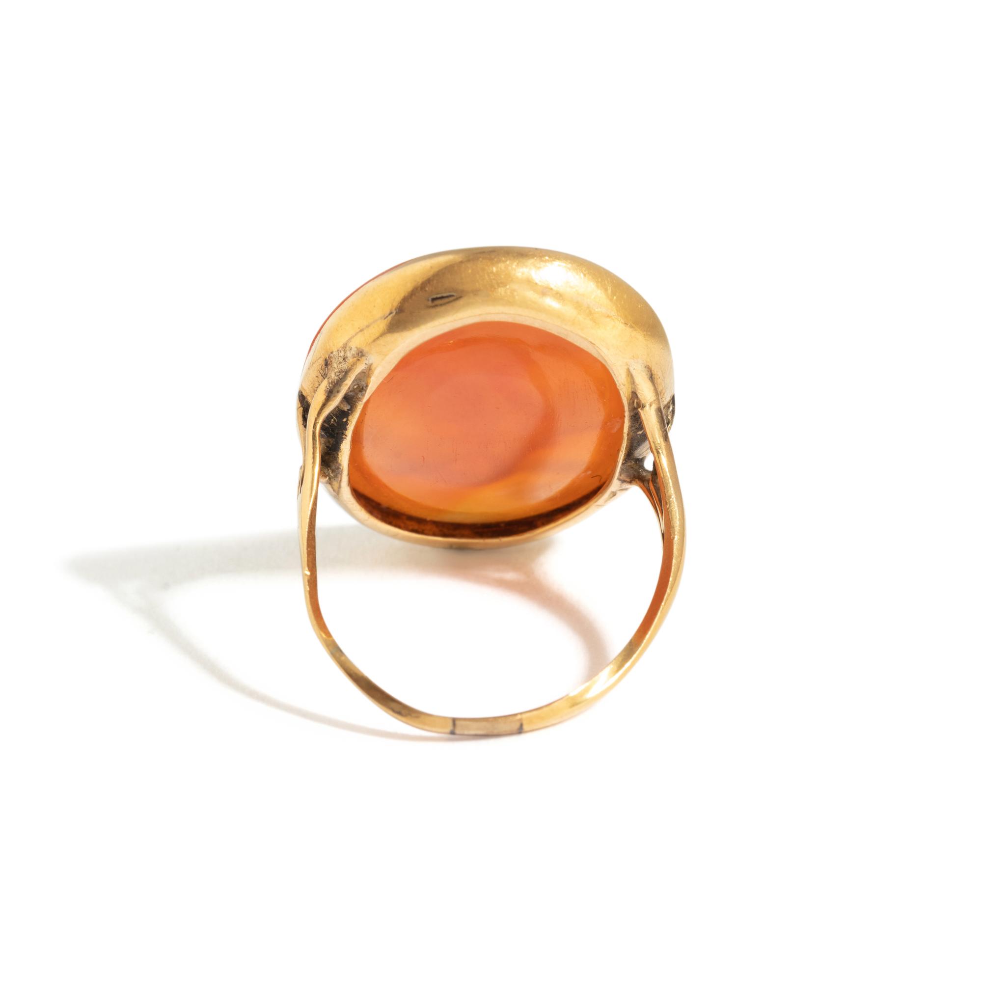 A Neoclassical Gold and Carnelian Finger Ring with a Muse Playing a Harp