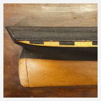 Two carved and painted half hull ship models late 19th/early 20th century