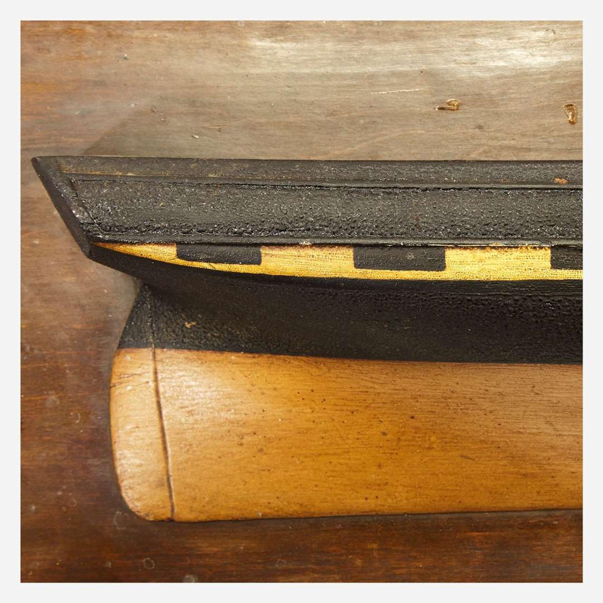Two carved and painted half hull ship models late 19th/early 20th century