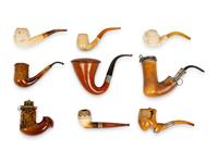 A Group of Nine Carved Meerschaum and Wooden Pipes