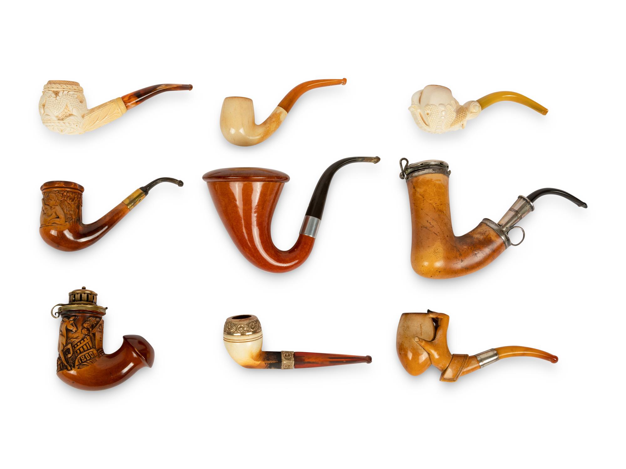 A Group of Nine Carved Meerschaum and Wooden Pipes