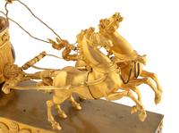An Empire Gilt Bronze Figural Mantel Clock