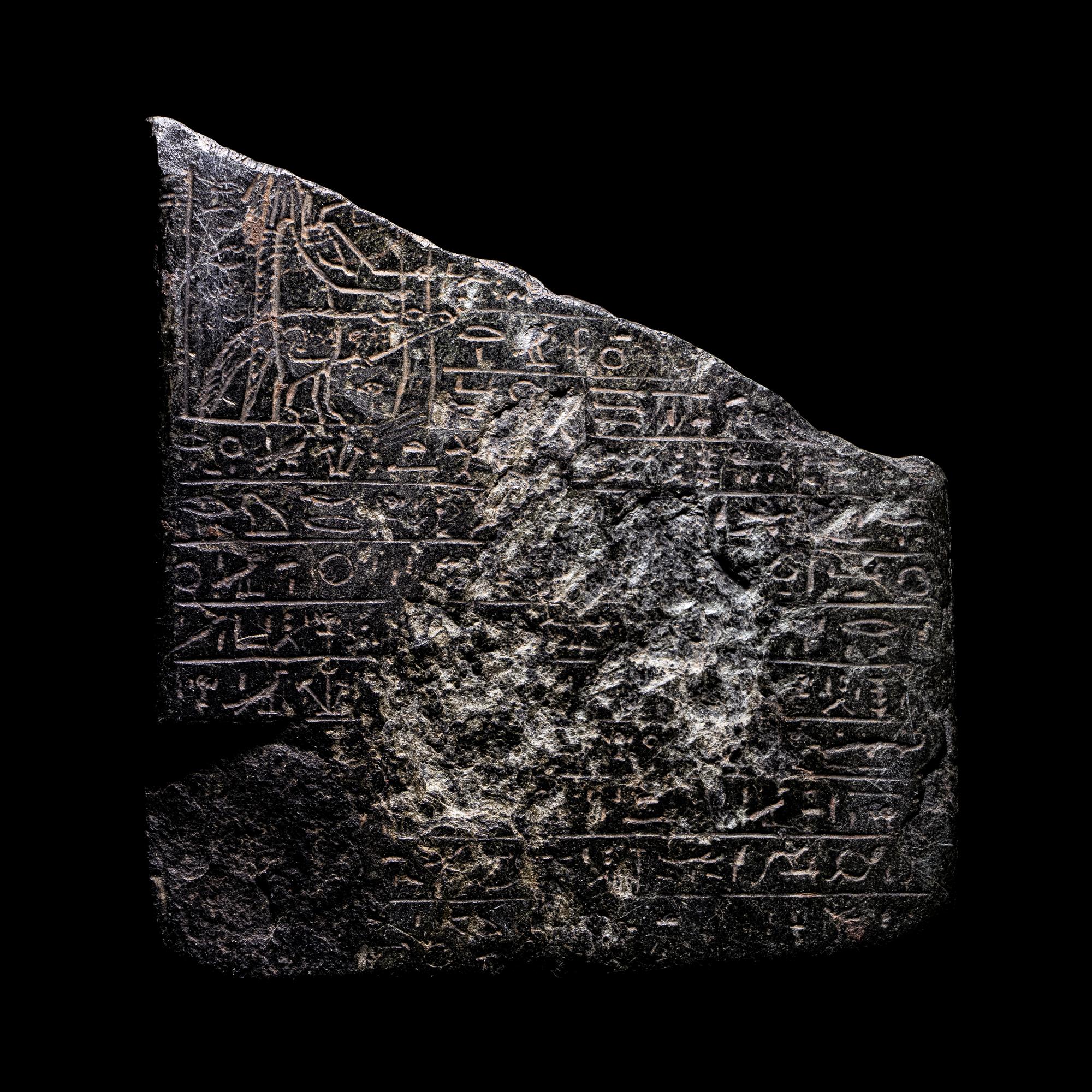 An Egyptian Black Steatite Cippus Fragment