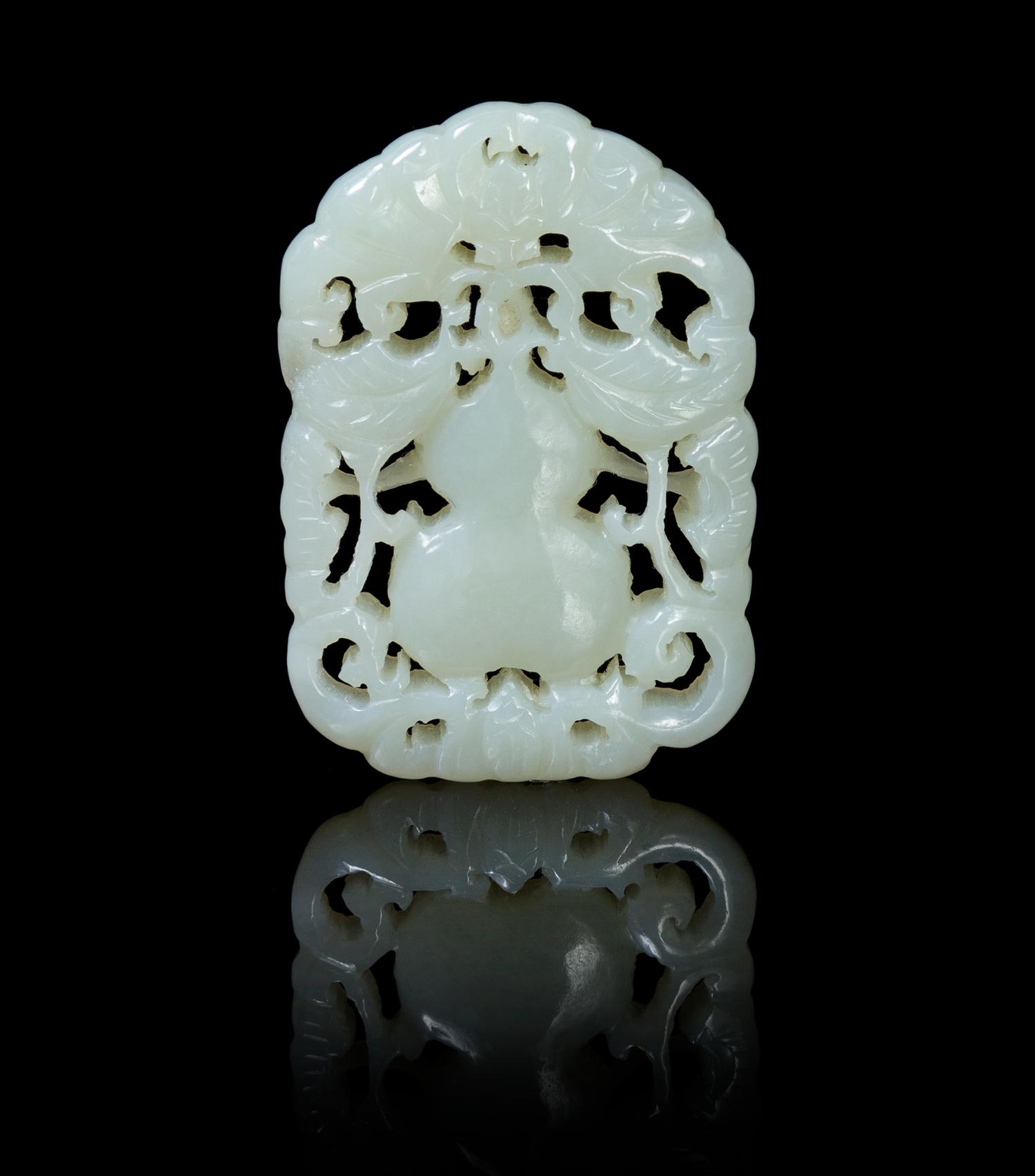 A Pierce Carved Pale Celadon Jade Pendant Height 1 7/8 inches.