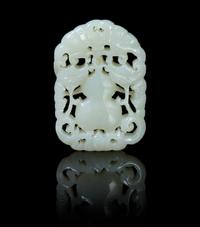 A Pierce Carved Pale Celadon Jade Pendant Height 1 7/8 inches.