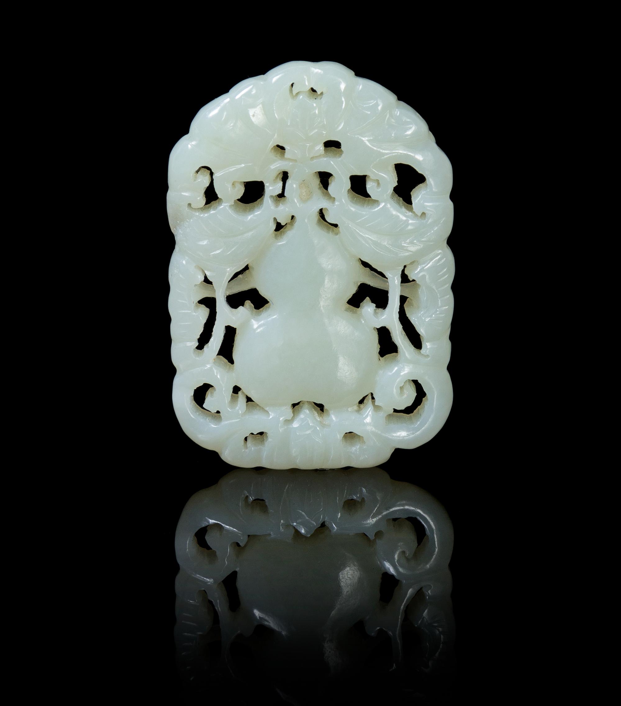 A Pierce Carved Pale Celadon Jade Pendant Height 1 7/8 inches.