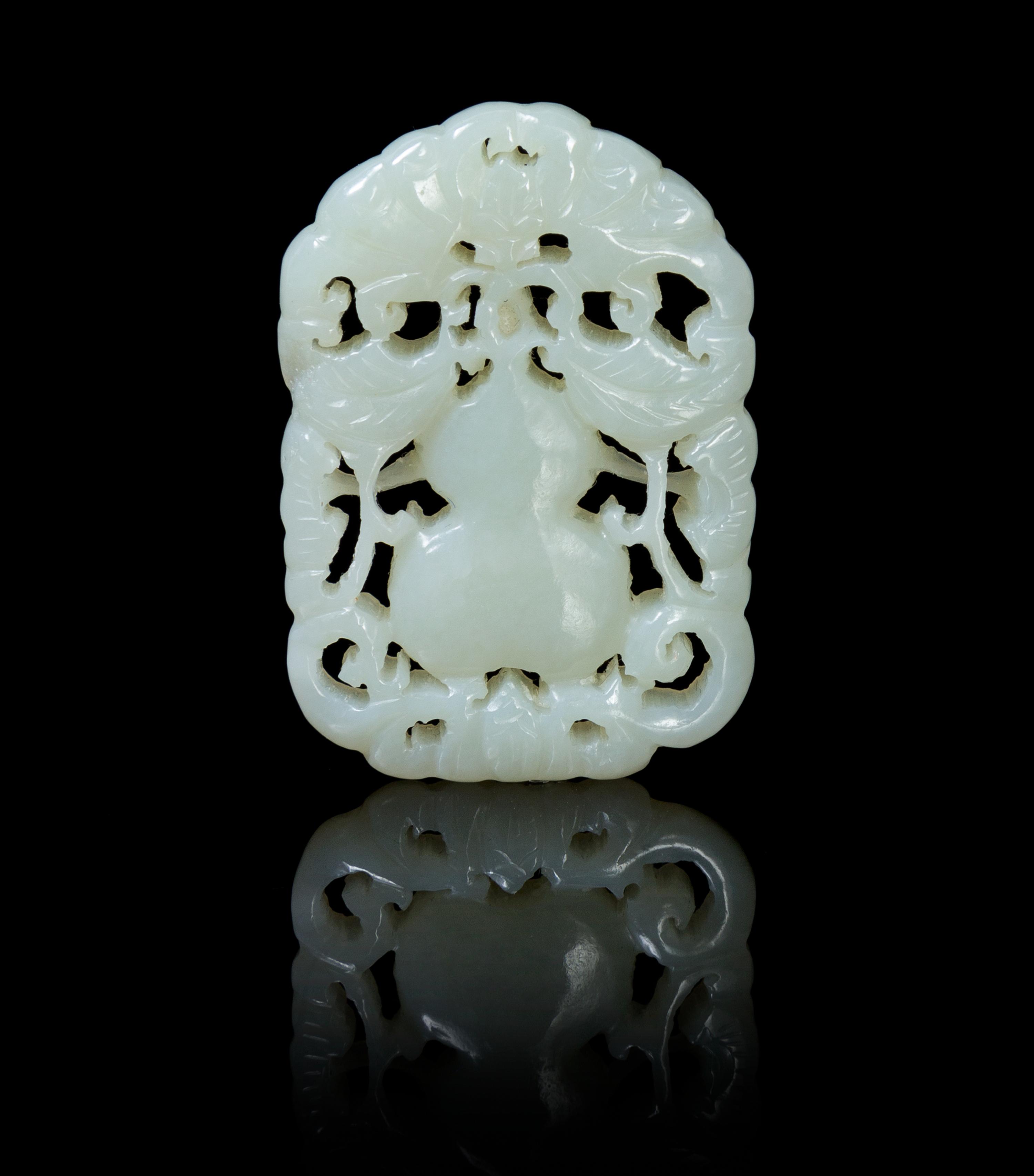 A Pierce Carved Pale Celadon Jade Pendant Height 1 7/8 inches.