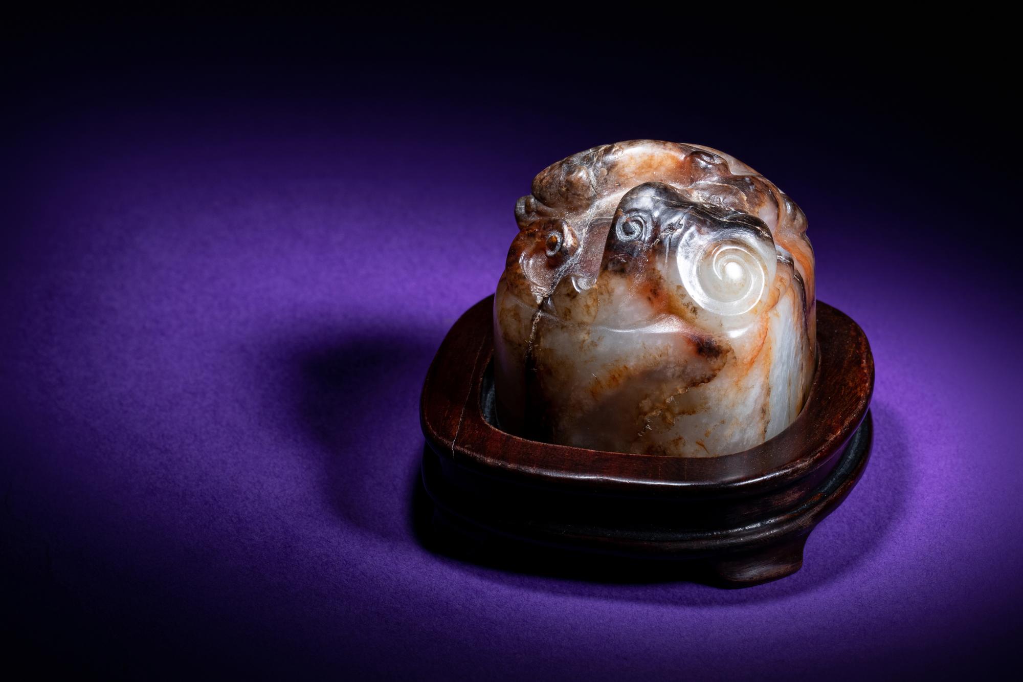 A Chinese White and Russet Jade Seal