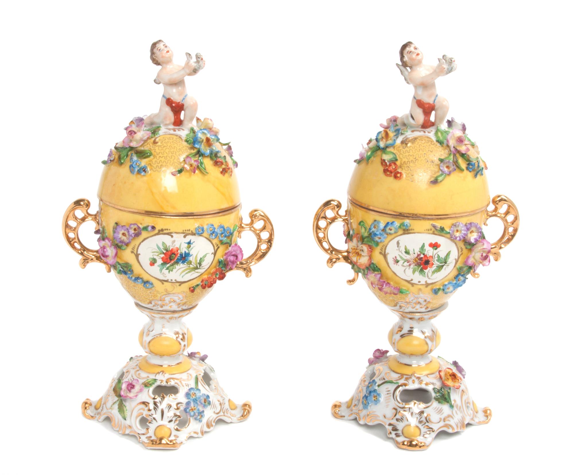 A Pair of Royal Vienna Covered Urns Height 9 1/4 inches.