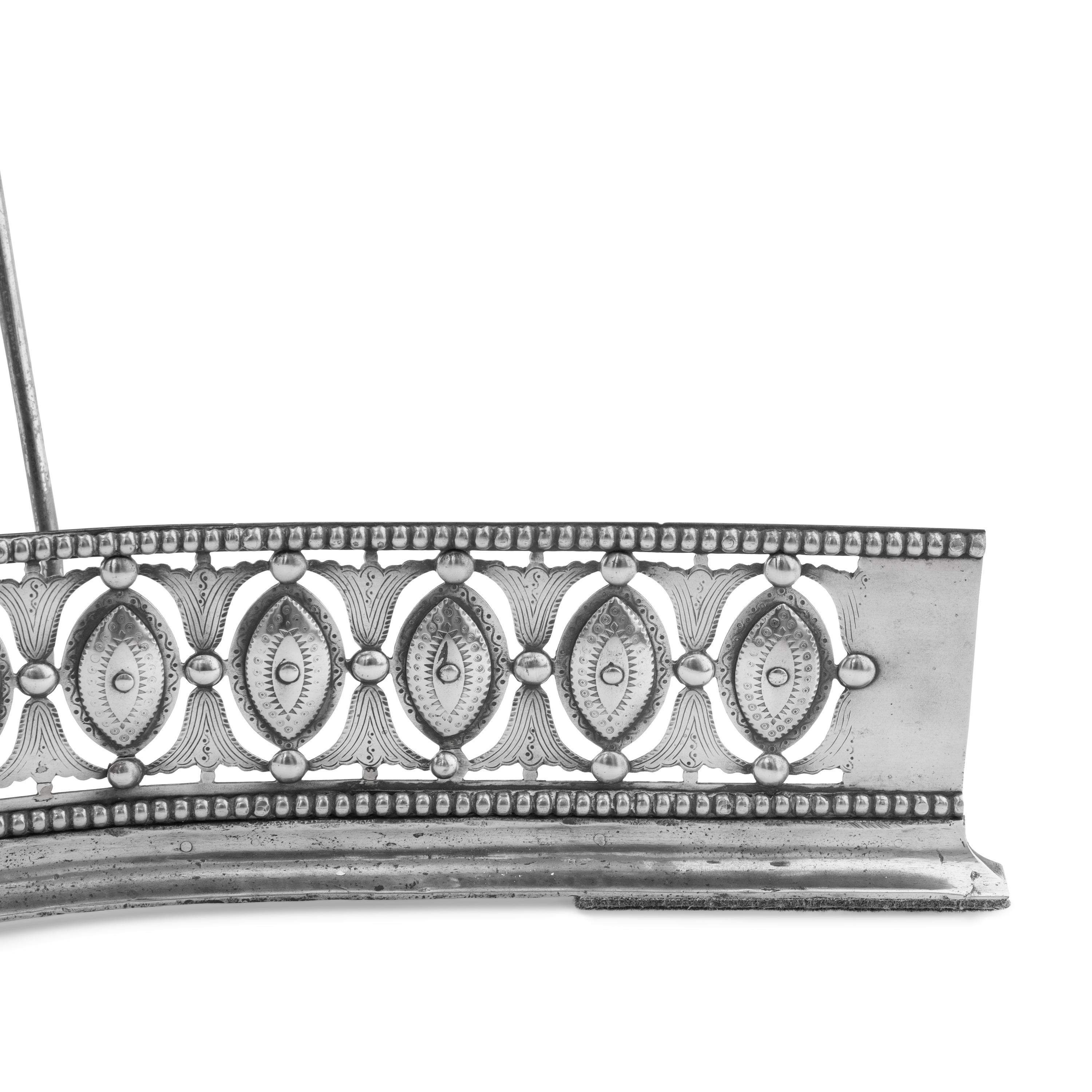 A George III Steel Serpentine Fender and Fireplace Tools