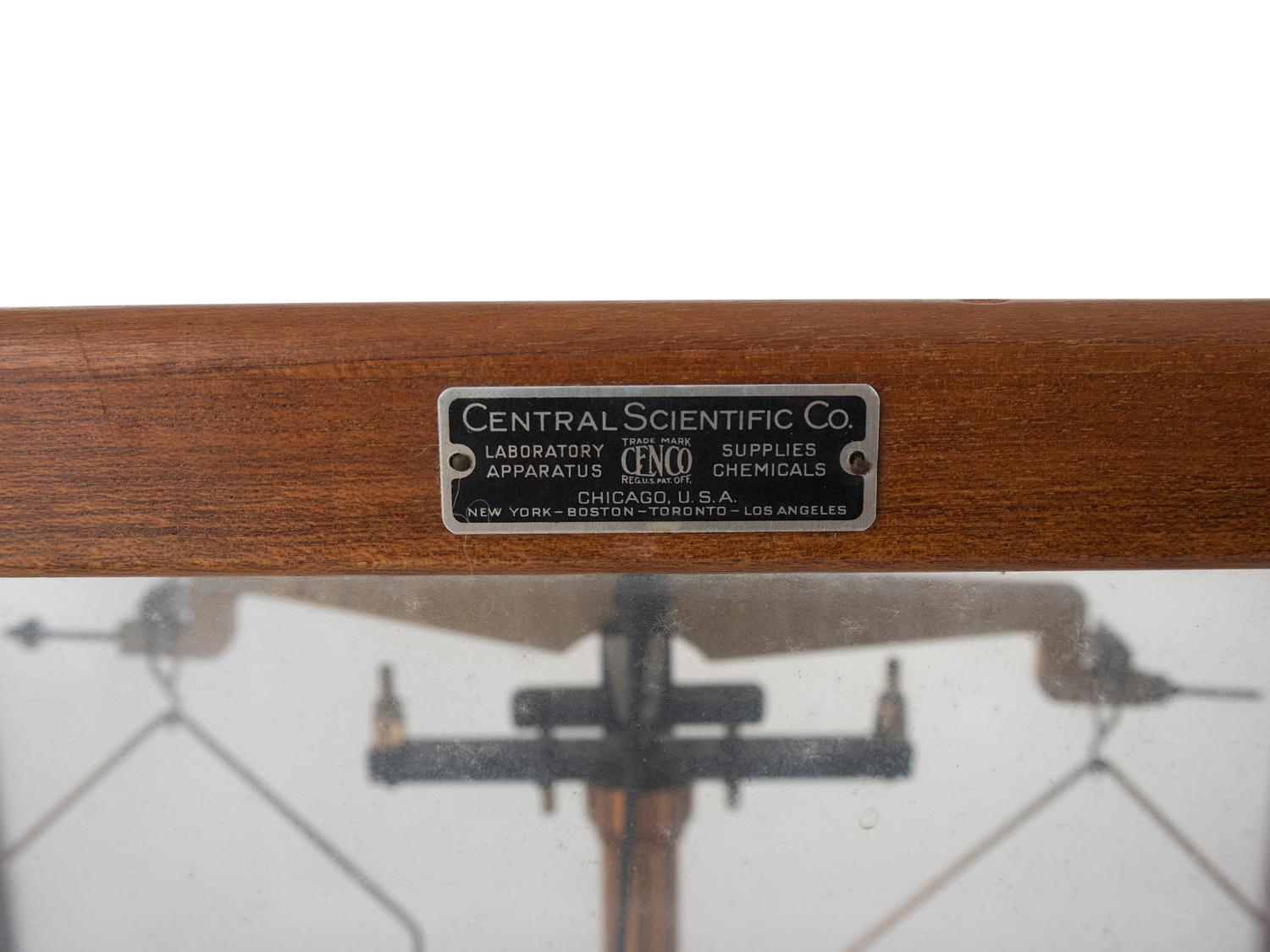 A Central Scientific Co. Scale, an Ingraham Eight-Day Movement Mantle Clock and Framed Salesmen Samples of Blue Grass Axes
