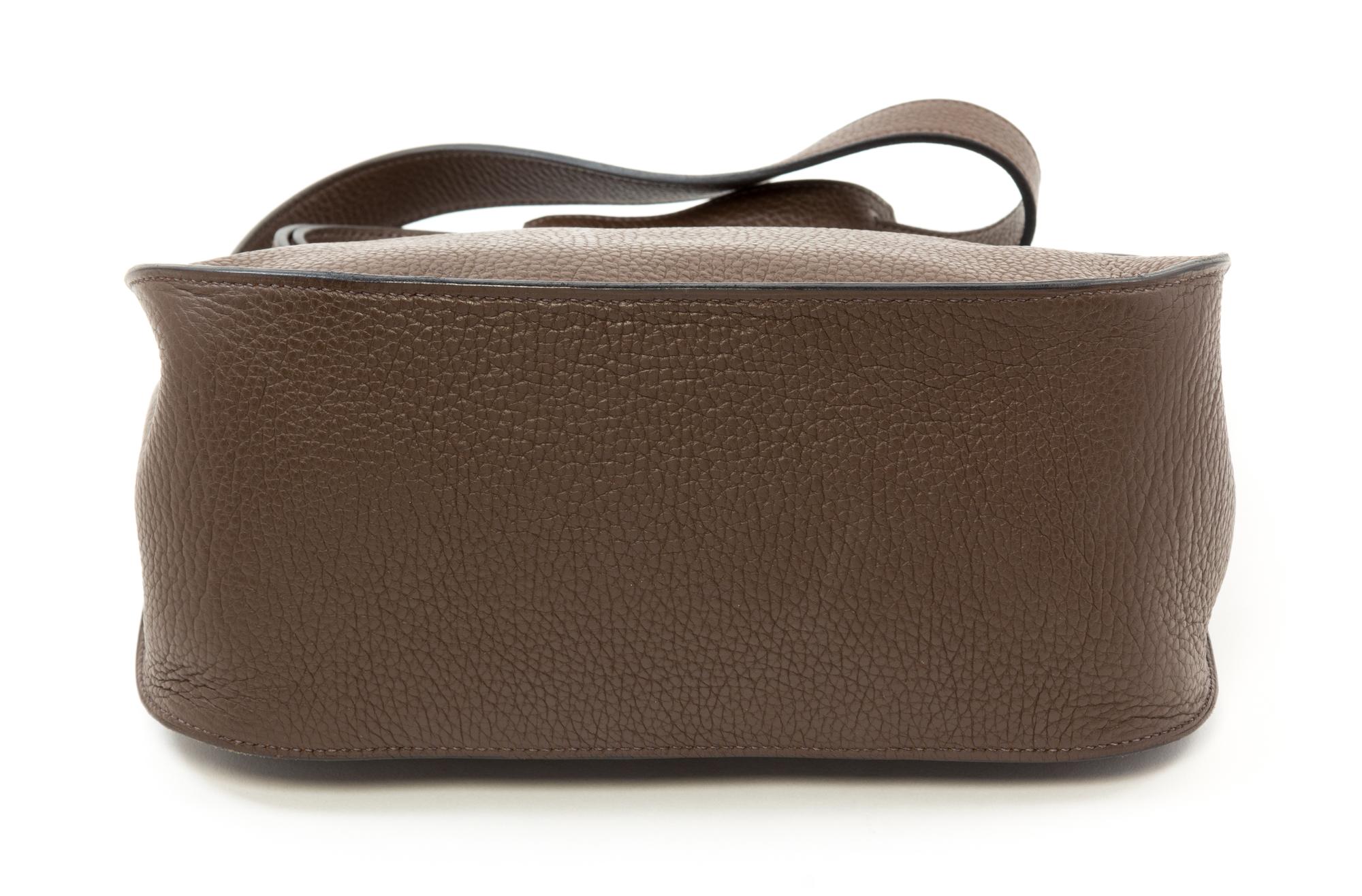 An Hermès Chocolate Taurillon Clemence Jypsiere 28cm Bag, 11" x 8.5" x 5".
