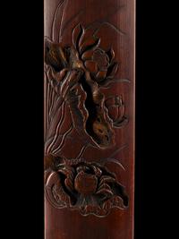 A Chinese Carved Bamboo 'Lotus and Crab' Wrist Rest