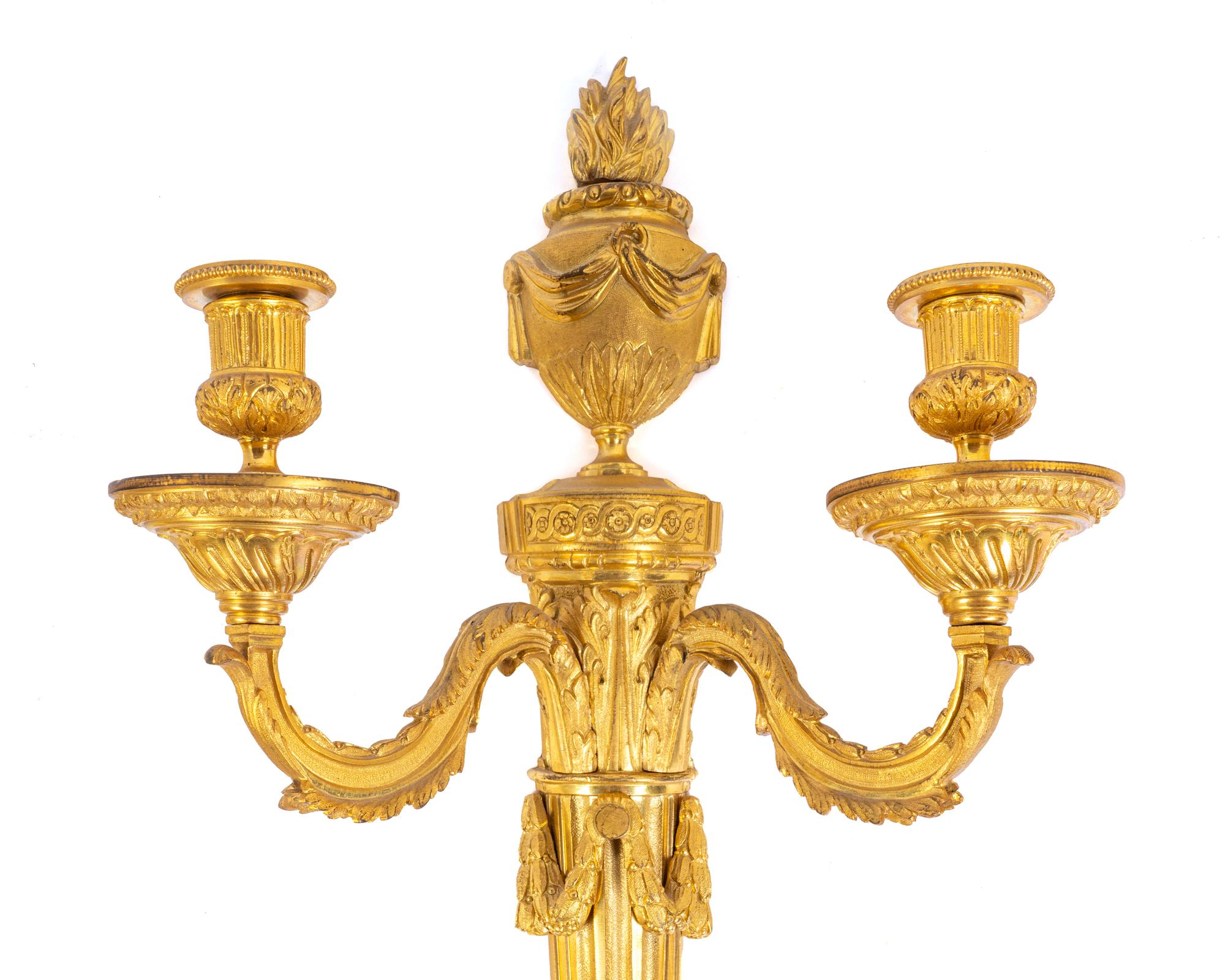 A Pair of Louis XVI Gilt Bronze Two-Light Sconces
