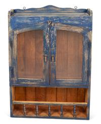 A Rustic Hanging Cabinet in Old Blue Paint