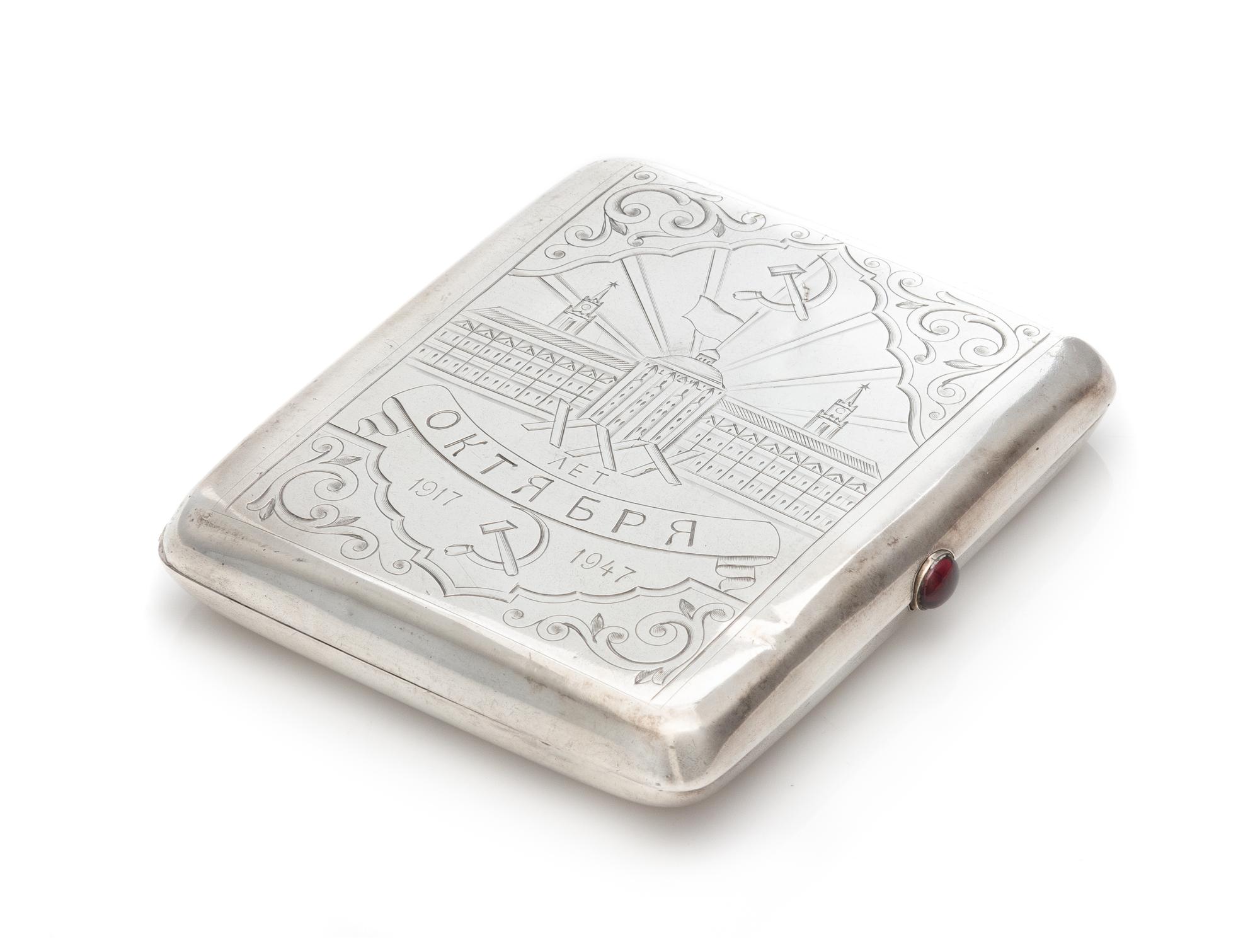 A Soviet-Era Russian Silver Cigarette Case, Mark of the Jeweller Art Artel, Moscow, Mid-20th Century, the lid worked to show a hammer a