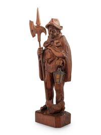 A Black Forest Carved Walnut 'Night Watchman' Lamp