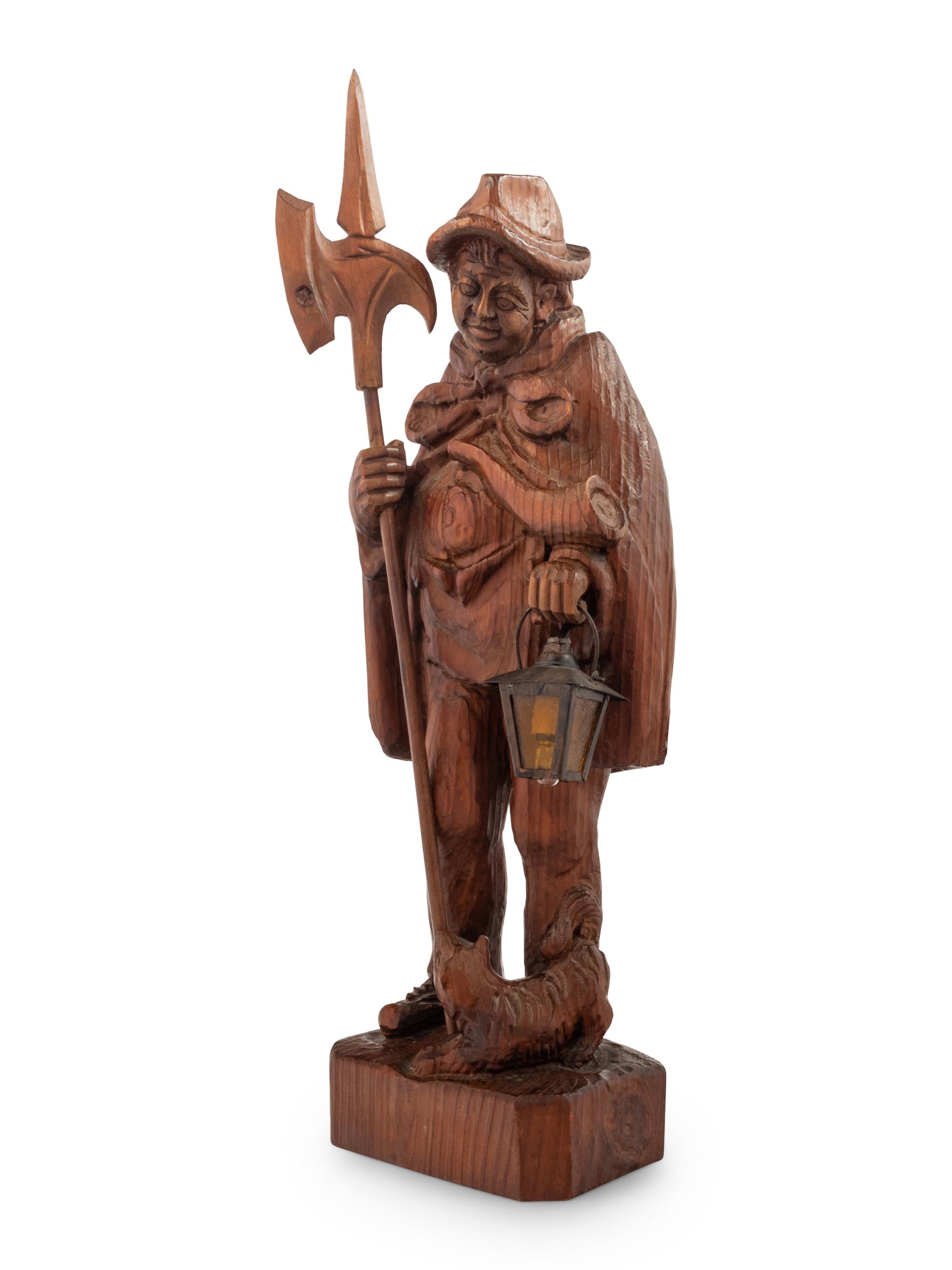A Black Forest Carved Walnut 'Night Watchman' Lamp