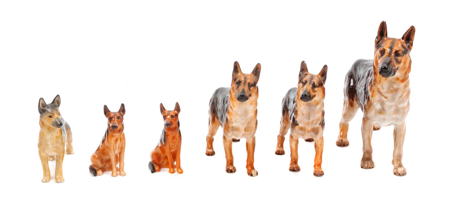 A Group of Six Porcelain German Shepherds Width of widest 8 inches.