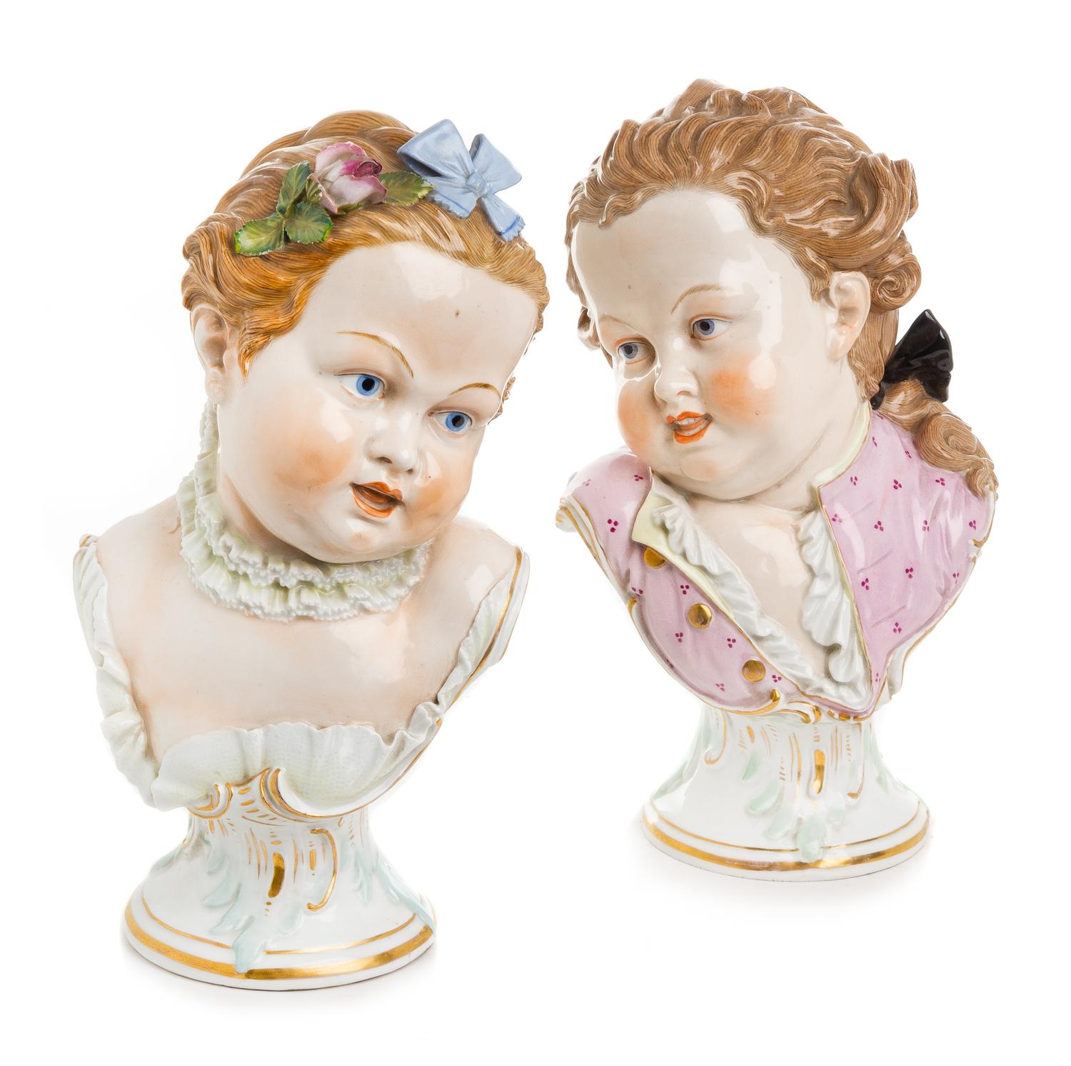 A Pair of German Porcelain Busts Height 11 inches. — LATE 19TH/EARLY 20TH CENTURY