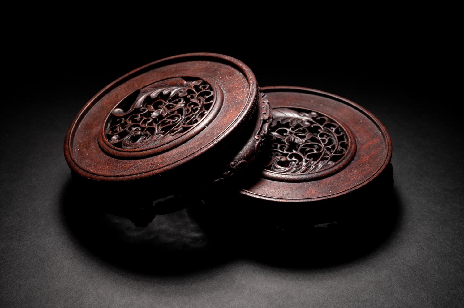 A Pair of Chinese Carved Hardwood Circular Stands