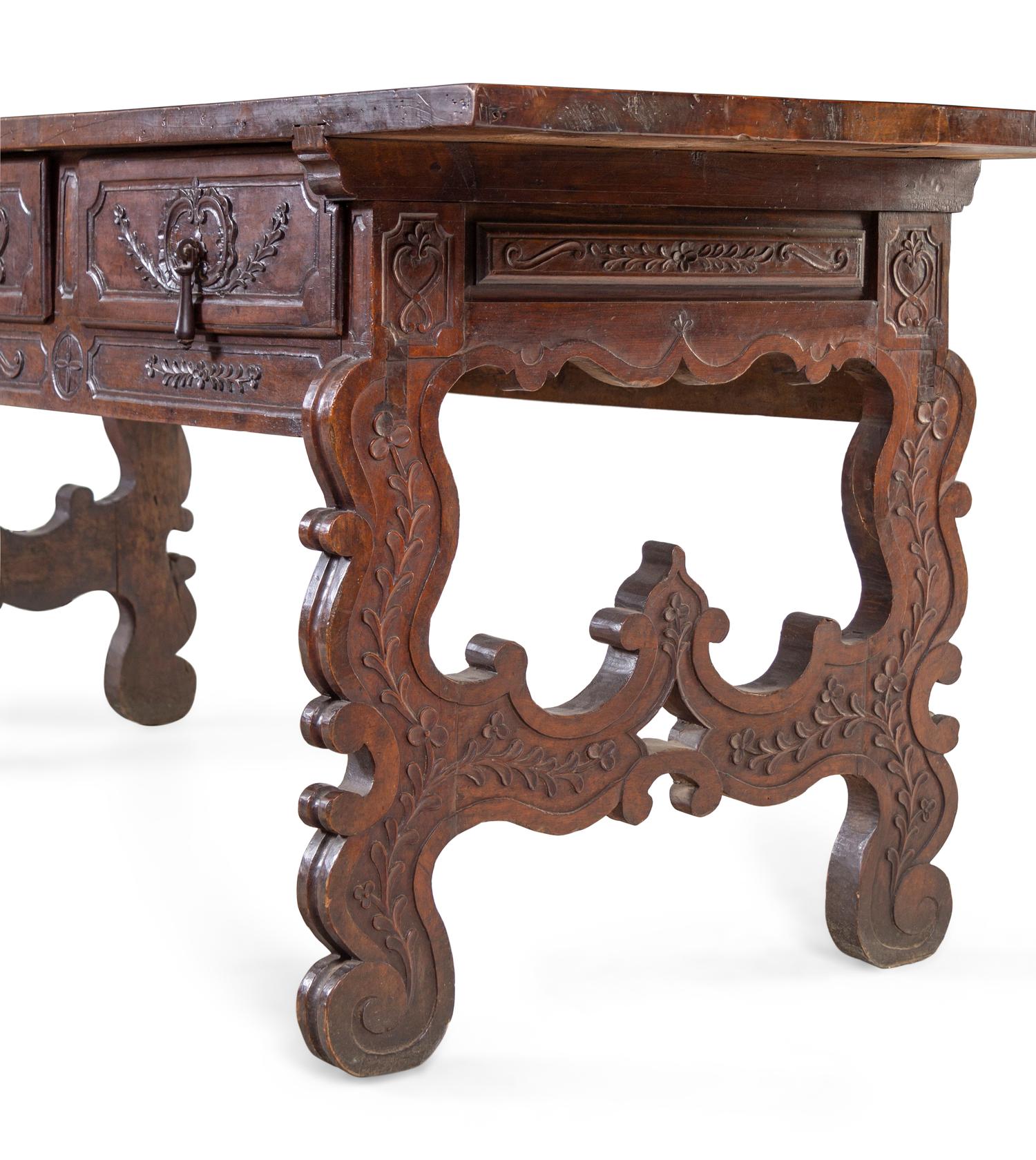 A Continental Carved Walnut Trestle Table
