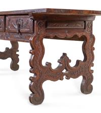 A Continental Carved Walnut Trestle Table