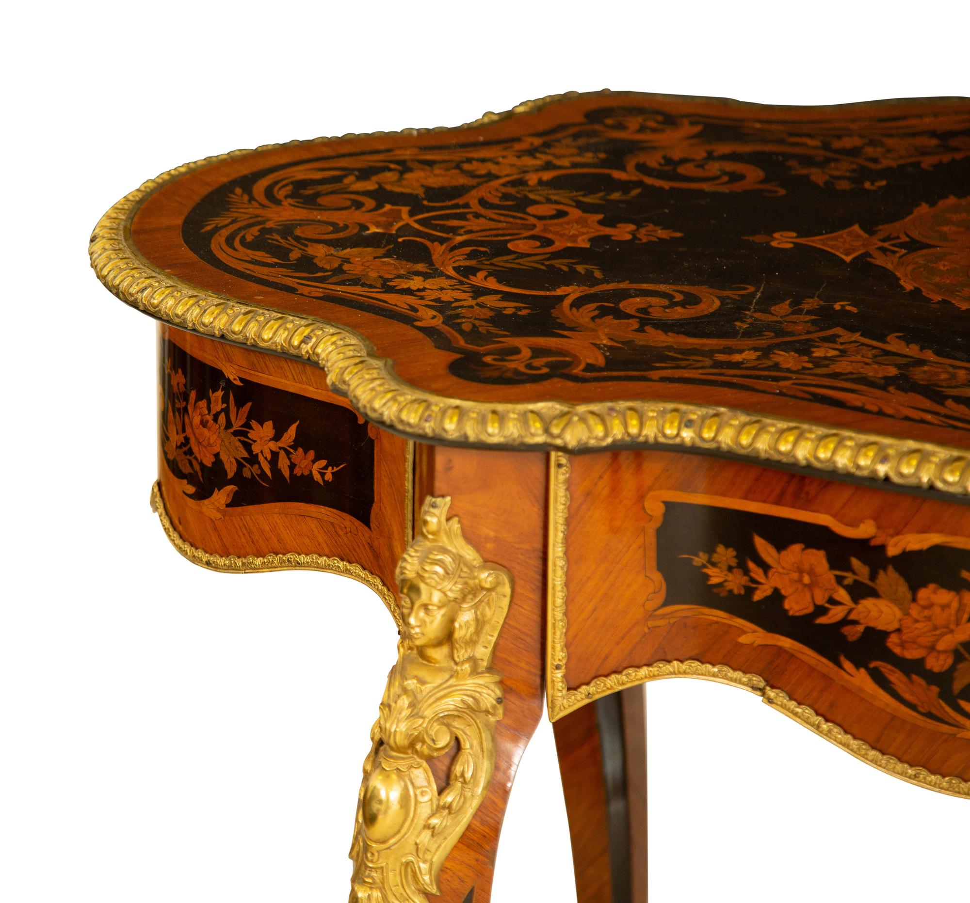 A Napoleon III Style Gilt Bronze Mounted Marquetry Center Table