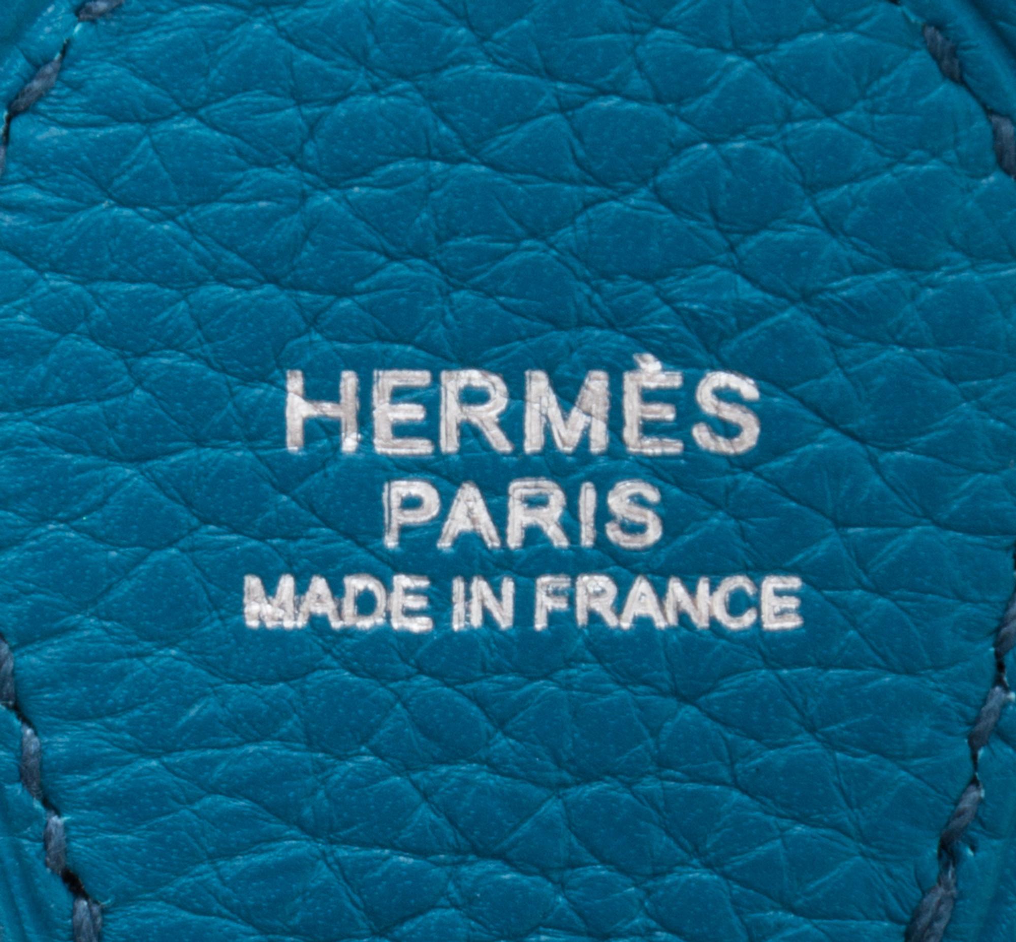 An Hermes Bleu Izmir Taurillon Clemence Evelyne III PM Handbag, 11.25" x 12" x 2.5".