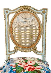 A Pair of Louis XVI Style Painted and Parcel-Gilt Chaises