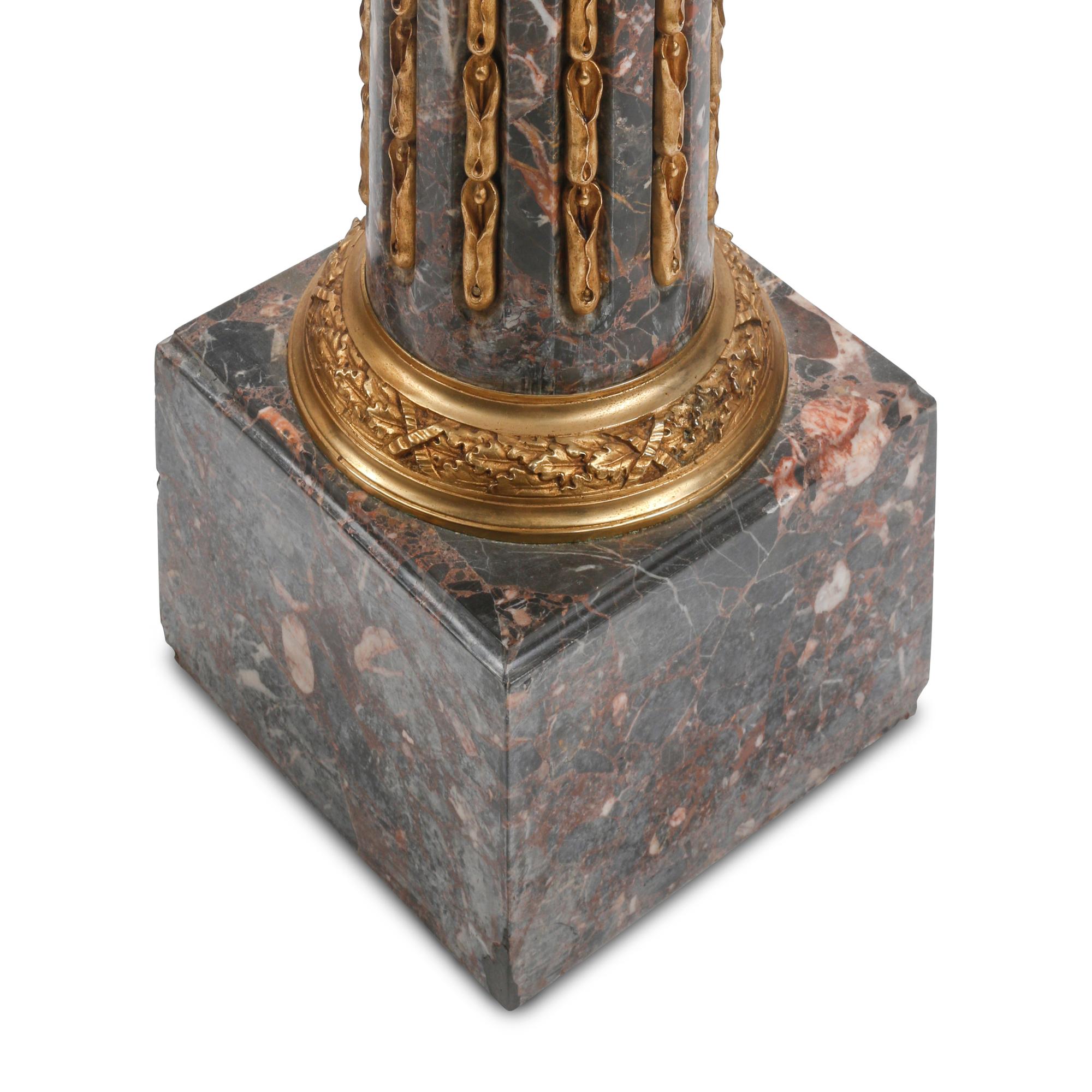 A Pair of Louis XVI Style Gilt Bronze Mounted Marble Pedestals