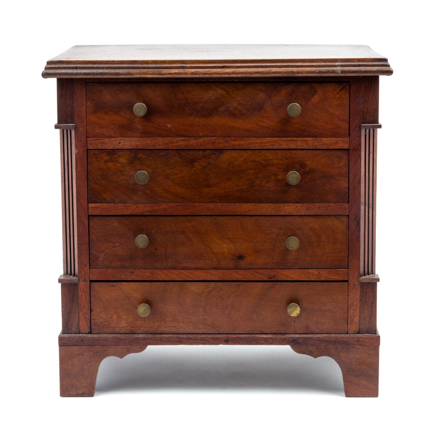 An American Mahogany Diminutive Chest of Drawers Height 15 3/4 x width 14 3/4 x depth 10 1/8 inches.