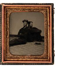 [CIVIL WAR]. Sixth plate tintype of two Union sailors casually sitting back to back on a studio floor.