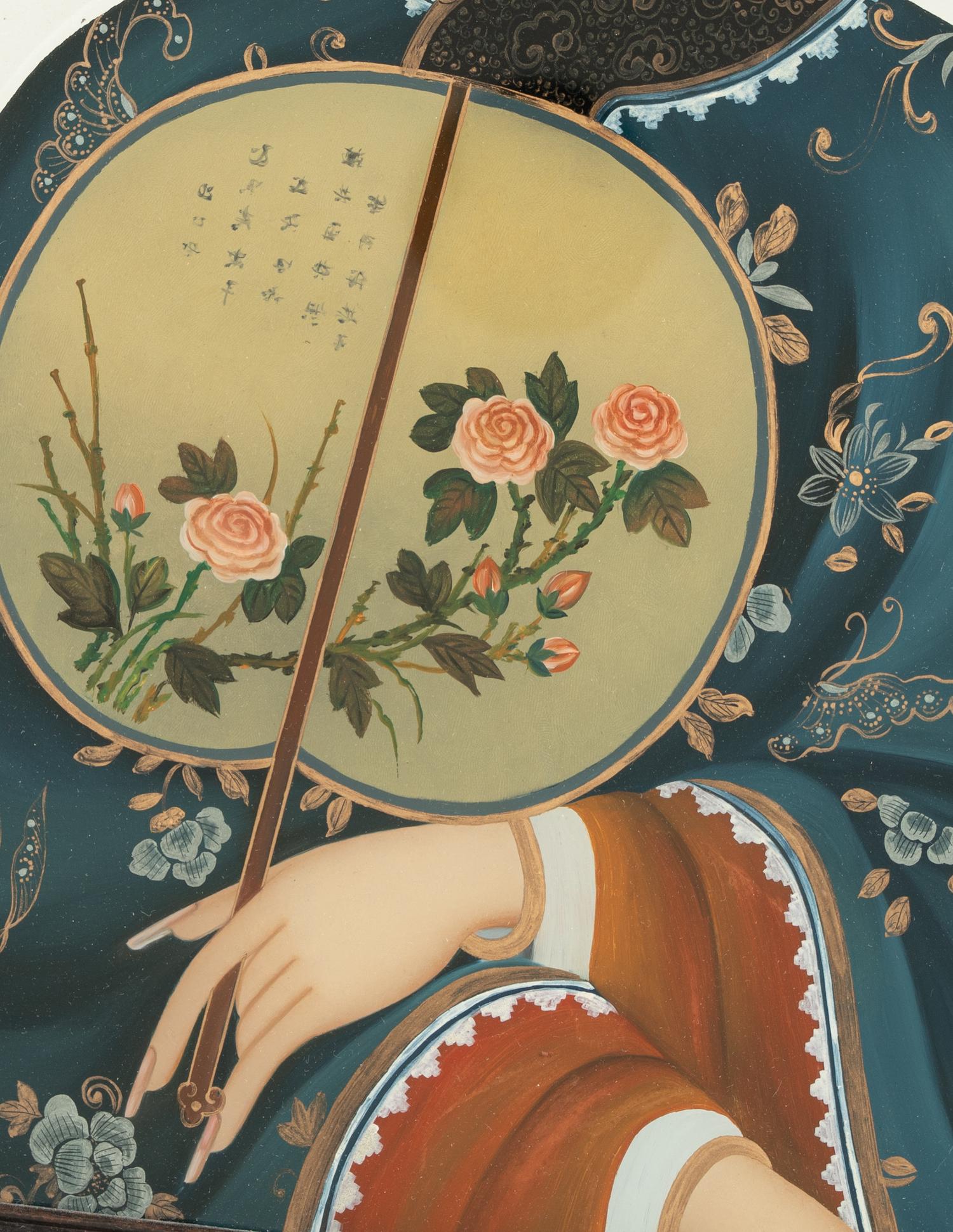 A Chinese Export Reverse-Painted Glass Mirror