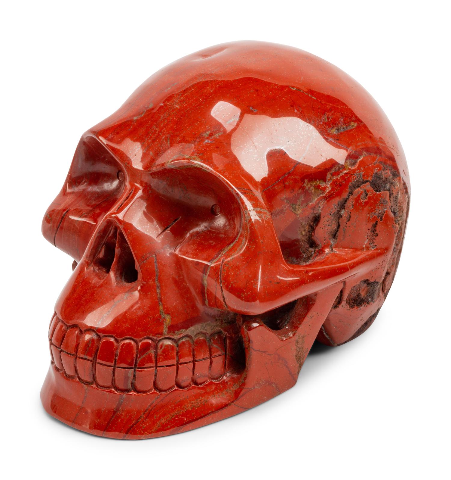 A Set of Four Carved Agate, Fluorite, Red Jasper and Black Obsidian Skulls