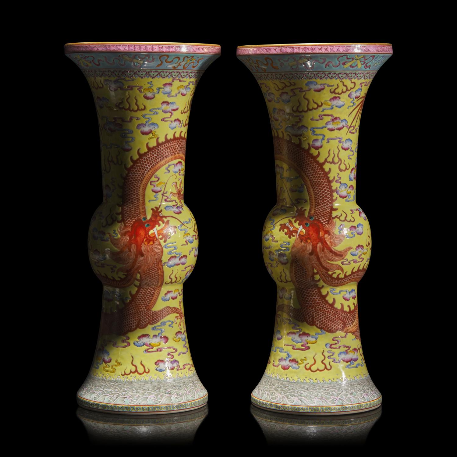 A Pair of Chinese Yellow Ground Finely Decorated Famille Rose 'Dragon' Vases 黃地粉彩雲龍紋花觚一對