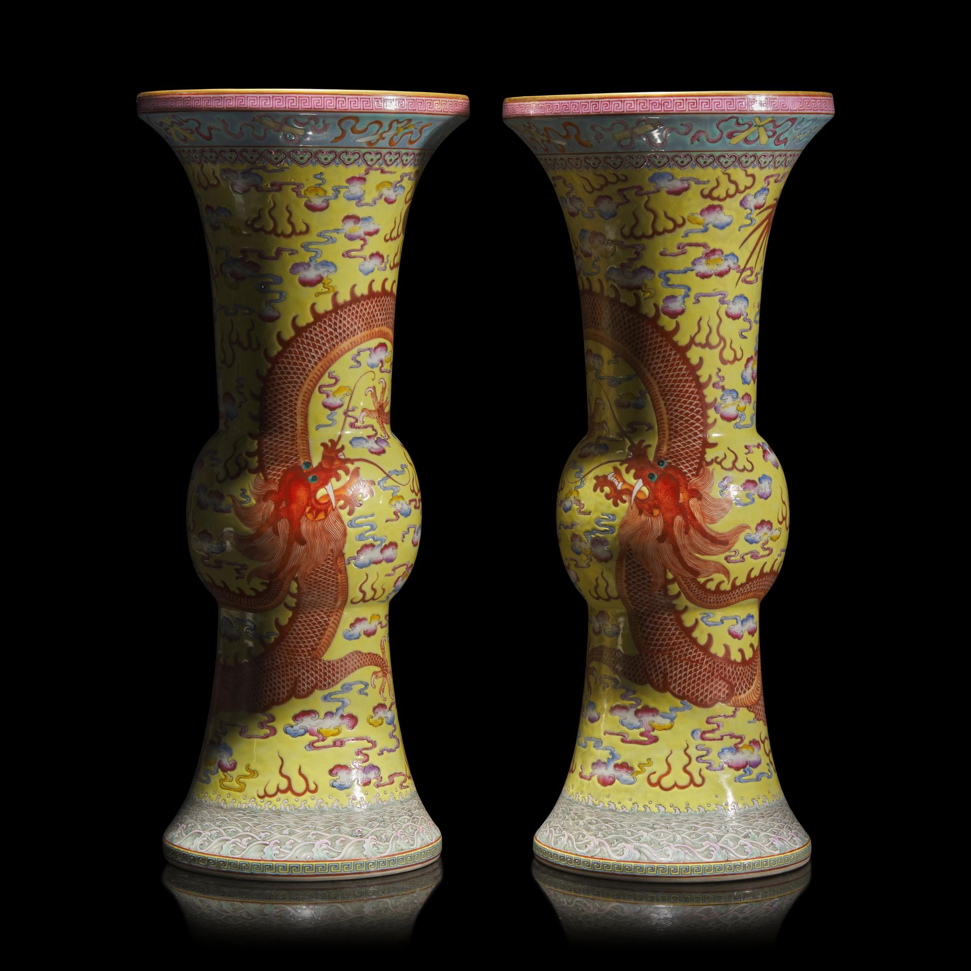 A Pair of Chinese Yellow Ground Finely Decorated Famille Rose 'Dragon' Vases 黃地粉彩雲龍紋花觚一對