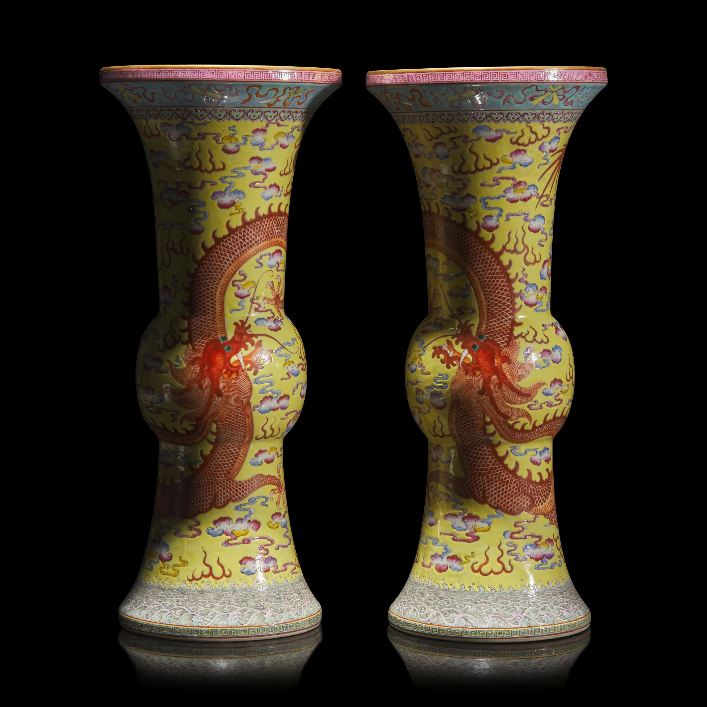 A Pair of Chinese Yellow Ground Finely Decorated Famille Rose 'Dragon' Vases 黃地粉彩雲龍紋花觚一對