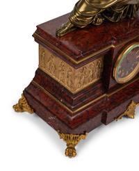 A French Neoclassical Gilt Bronze and Rouge Marble Clock Garniture