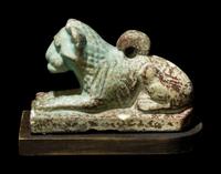 An Egyptian Faience Recumbent Lion