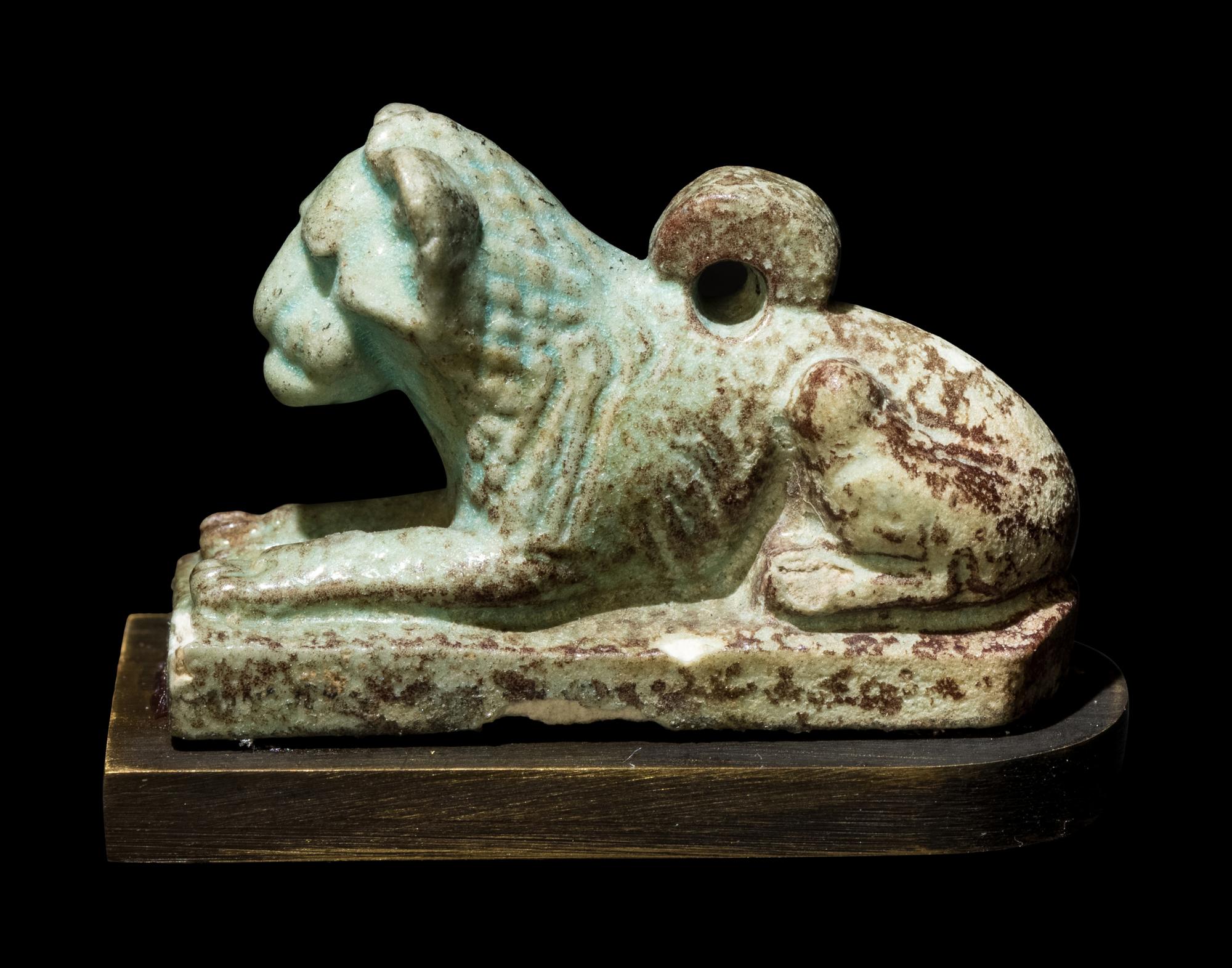 An Egyptian Faience Recumbent Lion