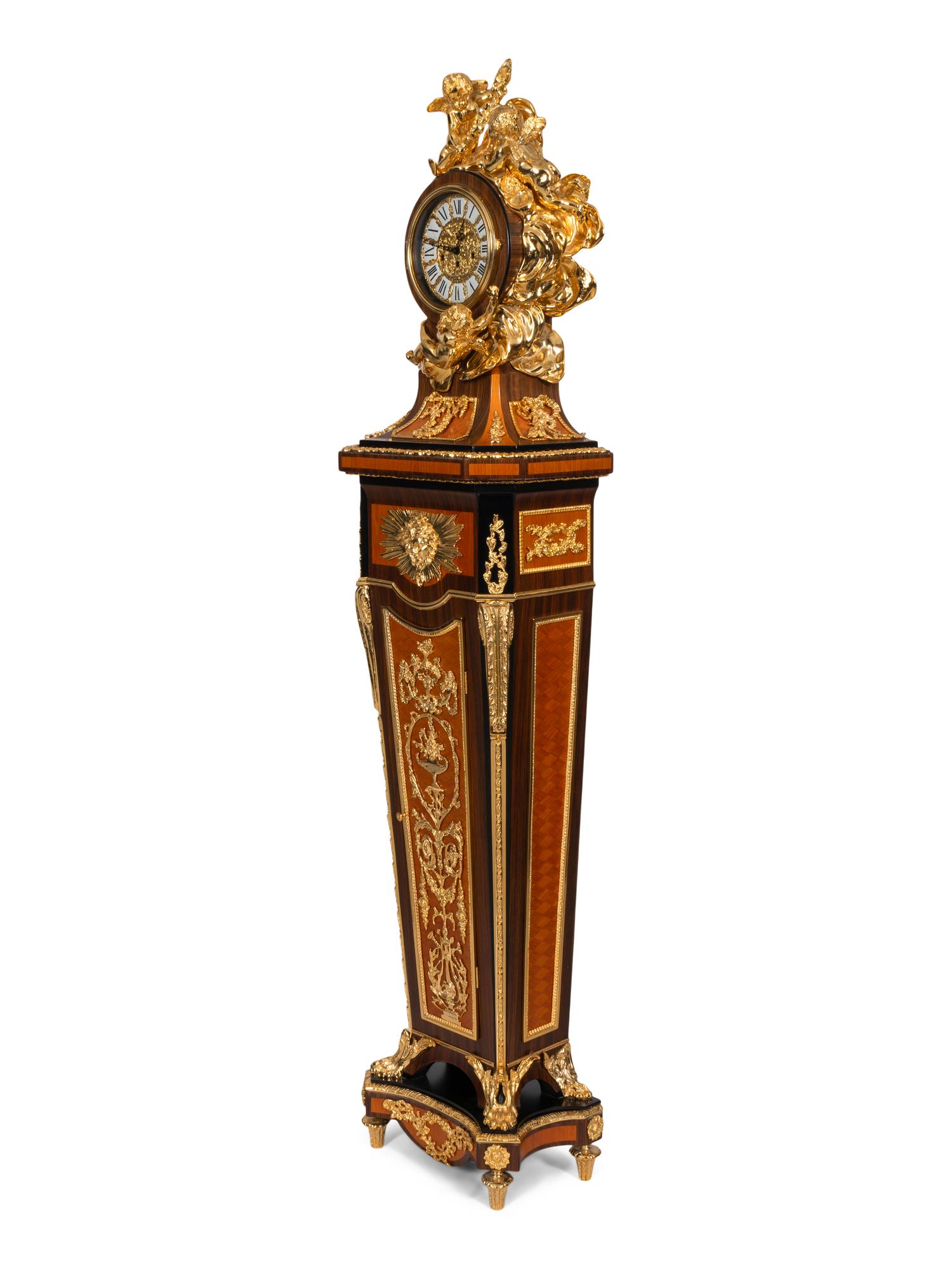 A Louis XVI Style Gilt Bronze Mounted Rosewood and Palisander Parquetry Longcase Clock