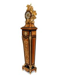 A Louis XVI Style Gilt Bronze Mounted Rosewood and Palisander Parquetry Longcase Clock